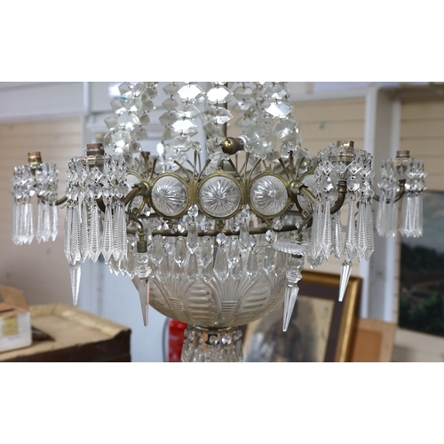 232 - An Edwardian cut glass chandelier, with swagged top and lozenge shaped drops sweeping down to the ma... 