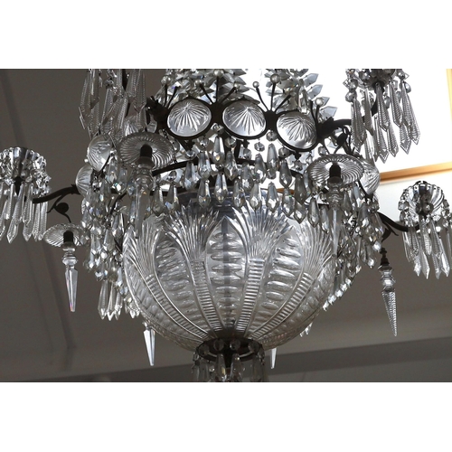 232 - An Edwardian cut glass chandelier, with swagged top and lozenge shaped drops sweeping down to the ma... 