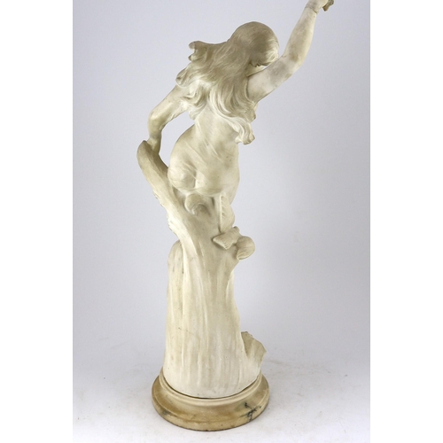 24 - An early 20th century Continental carved white marble figure of a sea nymph riding the waves with a ... 