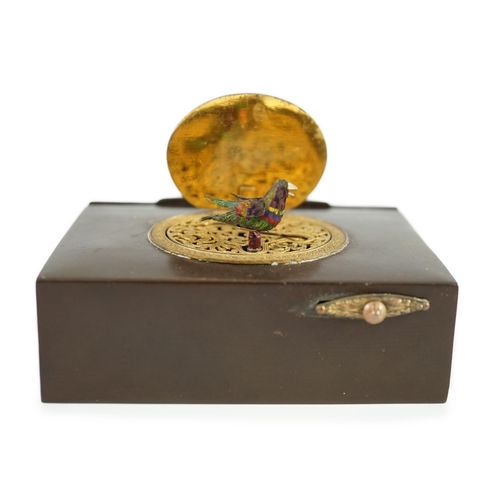 26 - A late 19th century Swiss gilt metal mounted phenolic singing bird box, the lid decorated in relief ... 