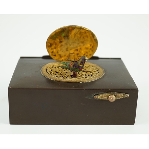 26 - A late 19th century Swiss gilt metal mounted phenolic singing bird box, the lid decorated in relief ... 