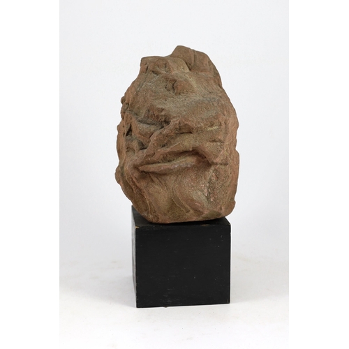 29 - A weathered sandstone head of Christ, probably 12th century, believed to have come from Strasbourg C... 