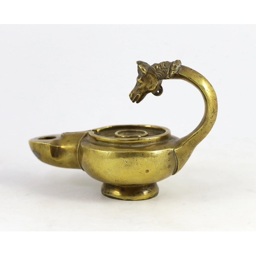 34 - A Renaissance or Roman bronze oil lamp, the high looped handle with horse head finial, 17.5cm long... 