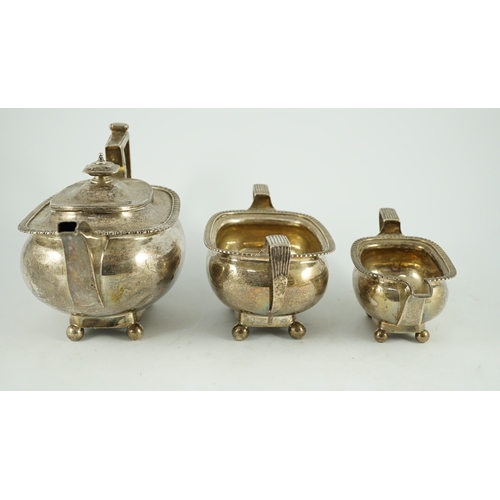 348 - A George III silver three piece 'London' shape tea service, by Samuel Hennell, London, 1811, gross 4... 