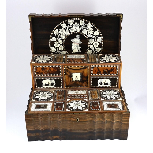 35 - A mid 19th century Anglo Indian ivory inset ebony and other exotic hardwood travelling casket, of se... 