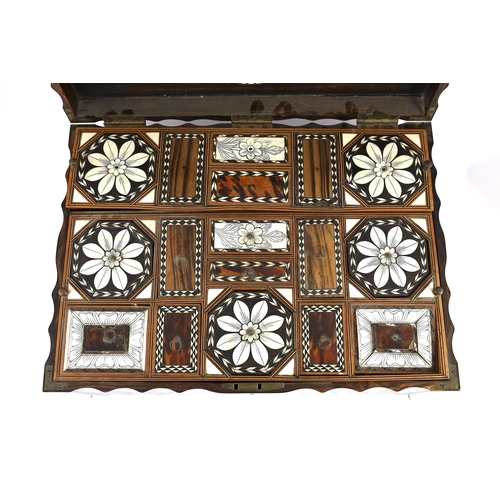 35 - A mid 19th century Anglo Indian ivory inset ebony and other exotic hardwood travelling casket, of se... 