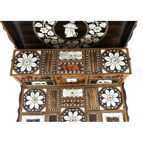 35 - A mid 19th century Anglo Indian ivory inset ebony and other exotic hardwood travelling casket, of se... 