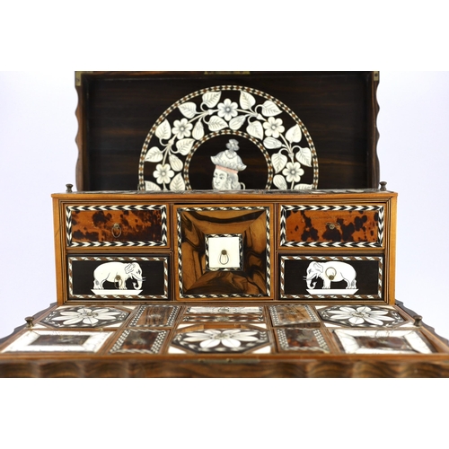 35 - A mid 19th century Anglo Indian ivory inset ebony and other exotic hardwood travelling casket, of se... 