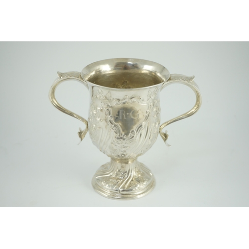 351 - A George III silver baluster two handled pedestal cup, with later embossed decoration, by John Scofi... 