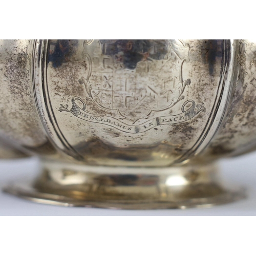 352 - A George IV silver three piece tea set by Benjamin Smith III, of squat melon form, with ornate engra... 