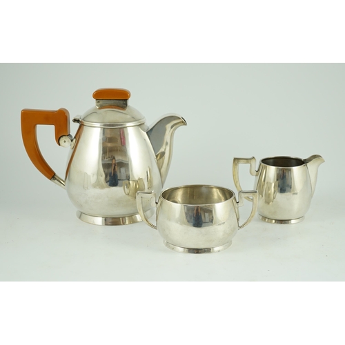 371 - A stylish George VI silver three piece tea set, by Ls Sl, with bakelite handles, London, 1947, gross... 