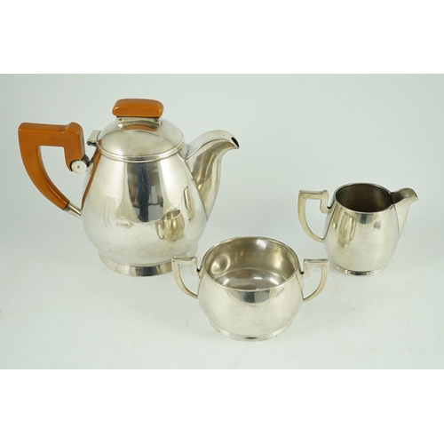 371 - A stylish George VI silver three piece tea set, by Ls Sl, with bakelite handles, London, 1947, gross... 