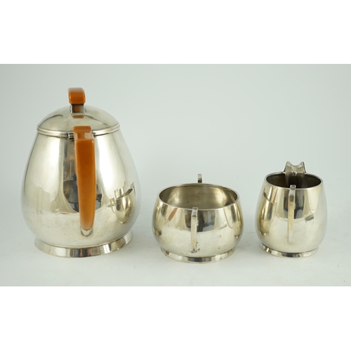 371 - A stylish George VI silver three piece tea set, by Ls Sl, with bakelite handles, London, 1947, gross... 