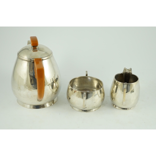 371 - A stylish George VI silver three piece tea set, by Ls Sl, with bakelite handles, London, 1947, gross... 