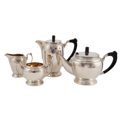 372 - A George VI four piece silver tea set, by Harrods Ltd, of circular and ovoid form, Sheffield, 1937, ... 