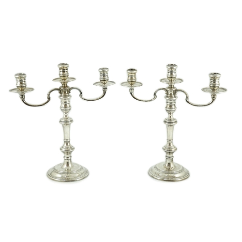 373 - A modern pair of silver two branch, three light candelabra by William Comyns & Sons Ltd, height 35.3... 