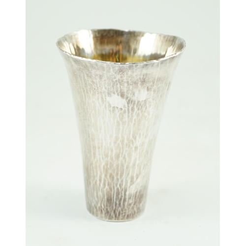 374 - A modern Britannia standard planished silver cup, by Malcolm Appleby, of flared form, with undulatin... 