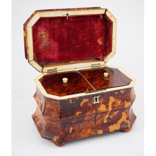 39 - A Regency blond tortoiseshell sarcophagus shaped tea caddy, of octagonal form, with ivory inner band... 