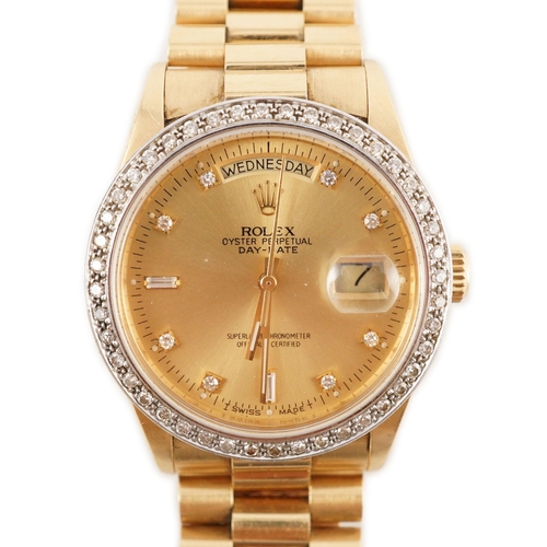 390 - A gentleman's 1980's 18ct gold and diamond set Rolex Oyster Perpetual Day-Date wrist watch, with dia... 