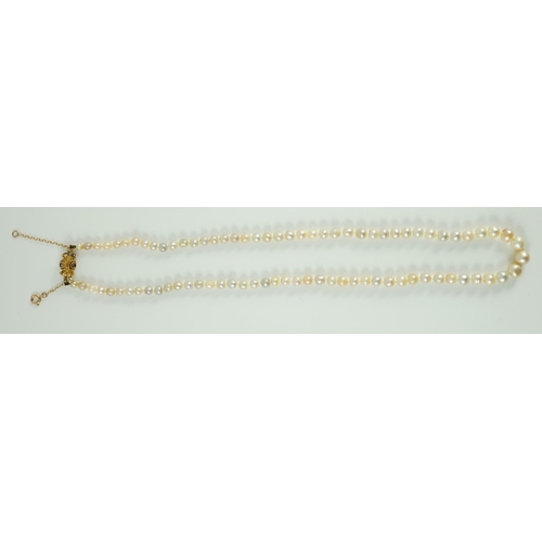 397 - A single strand graduated natural saltwater pearl necklace, with Gem and Pearl Laboratory report dat... 