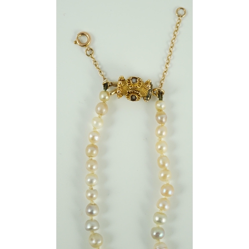 397 - A single strand graduated natural saltwater pearl necklace, with Gem and Pearl Laboratory report dat... 