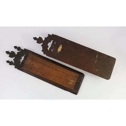 40 - An antique carved oak cased tobacco rasp, the wall mounting case carved in relief with a crowned ros... 