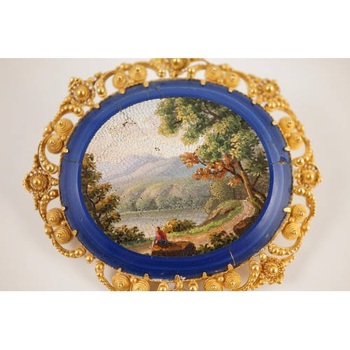 402 - A 19th century Italian gold mounted micro-mosaic oval brooch, depicting a countryside scene, 54mm, g... 