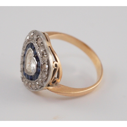 403 - A 1920's, gold and platinum, millegrain set sapphire and diamond cluster set ring, with central hear... 