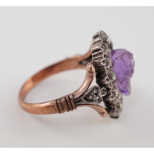 404 - A 19th century gold, carved amethyst and diamond cluster set dress ring, the stone carved with a ros... 