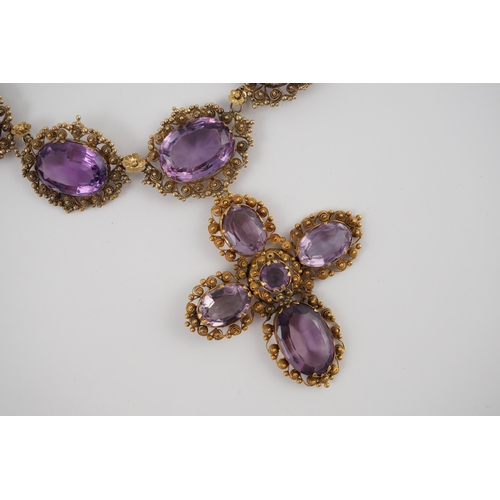 405 - An early 19th century gold and eleven stone oval cut amethyst set pendant necklace and a similar cro... 