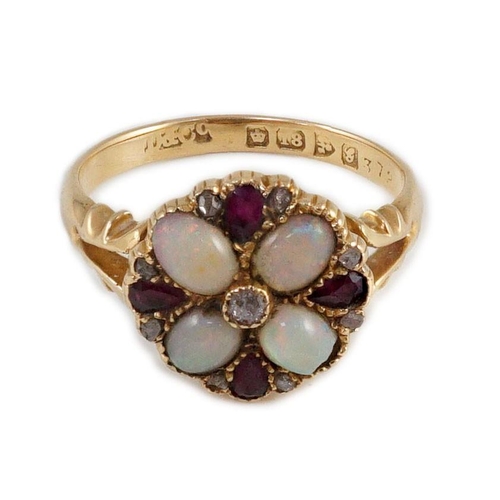 411 - An Edwardian 18ct gold, ruby, white opal and diamond set circular cluster dress ring, with split sho... 