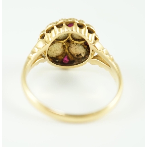 411 - An Edwardian 18ct gold, ruby, white opal and diamond set circular cluster dress ring, with split sho... 