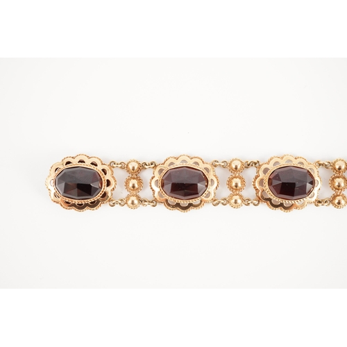 417 - A 20th century Dutch 14k gold and six stone facet cut cabochon garnet set fancy link bracelet, 19cm,... 