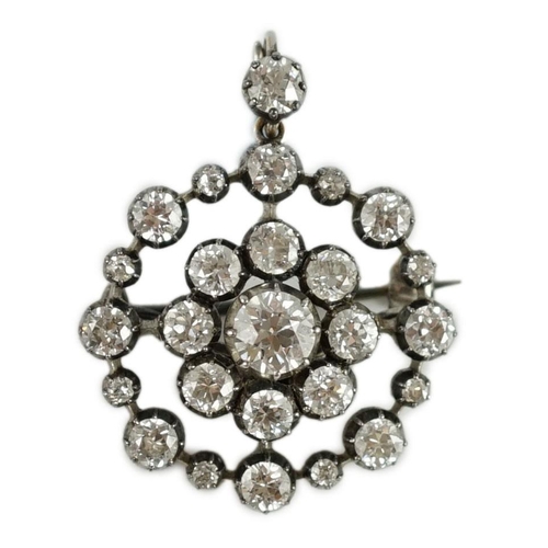 421 - A Victorian gold, silver and diamond cluster set target pendant brooch, set with round cut stones, t... 