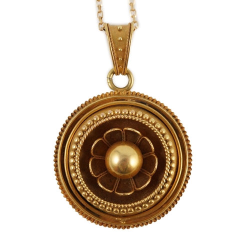 428 - A Victorian gold circular pendant, with flower head centre and glazed back, on a later 9ct gold chai... 