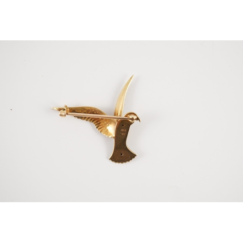 429 - An early 20th century two colour 18ct gold, 15ct gold and enamel set brooch, modelled as a bird of p... 