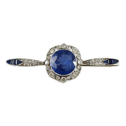 430 - An early 20th century French platinum, sapphire and diamond bar brooch, the central round cut sapphi... 