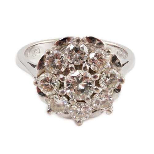 438 - A modern 18ct white gold and nine stone diamond illusion set circular cluster ring, size M/N, gross ... 