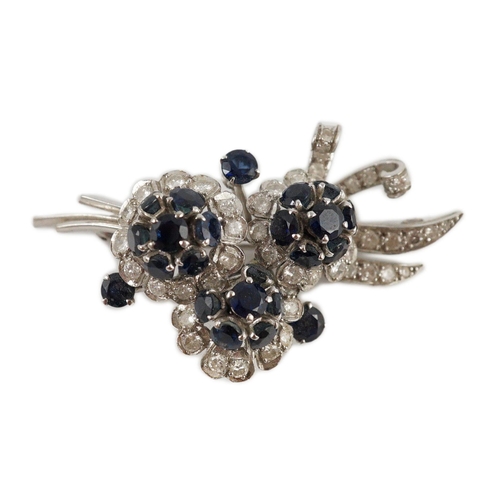 439 - A white gold, sapphire and diamond cluster set floral spray brooch, 53mm, gross weight 18.8 grams.... 