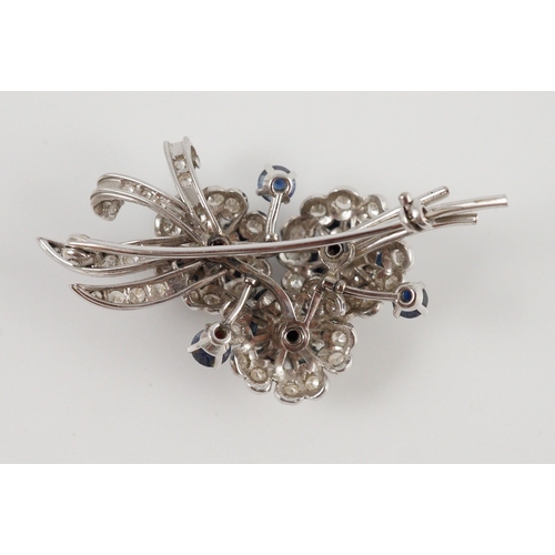 439 - A white gold, sapphire and diamond cluster set floral spray brooch, 53mm, gross weight 18.8 grams.... 