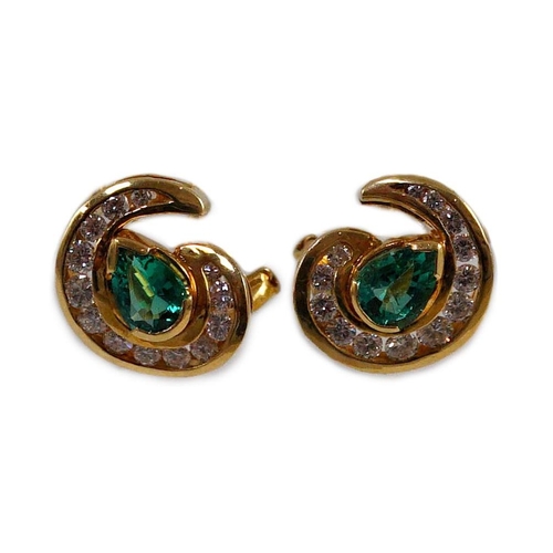 441 - A modern pair of gold (tests as 18ct), emerald and diamond set scrolling cluster earrings, total eme... 