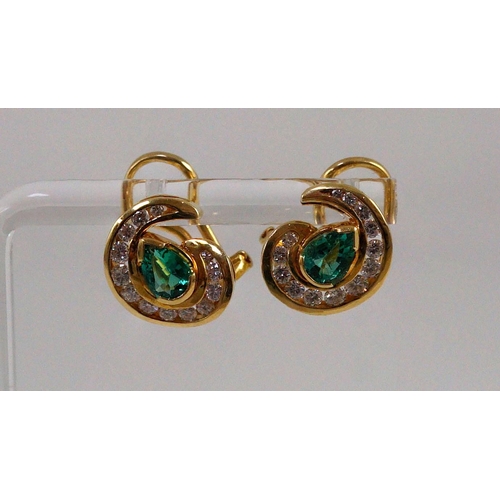 441 - A modern pair of gold (tests as 18ct), emerald and diamond set scrolling cluster earrings, total eme... 