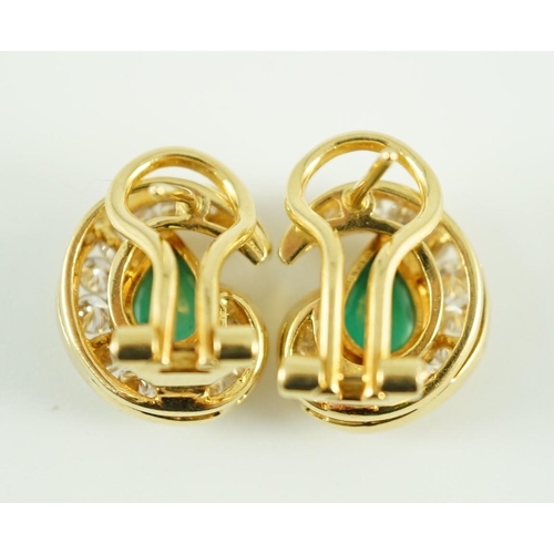 441 - A modern pair of gold (tests as 18ct), emerald and diamond set scrolling cluster earrings, total eme... 