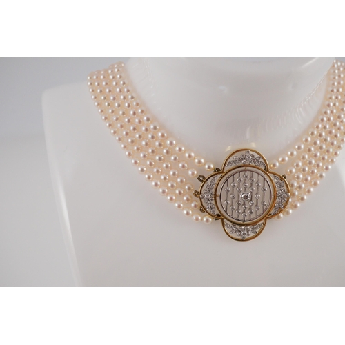 443 - A quintuple strand seed pearl choker necklace, with pierced gold, platinum and diamond cluster set q... 