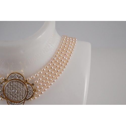 443 - A quintuple strand seed pearl choker necklace, with pierced gold, platinum and diamond cluster set q... 