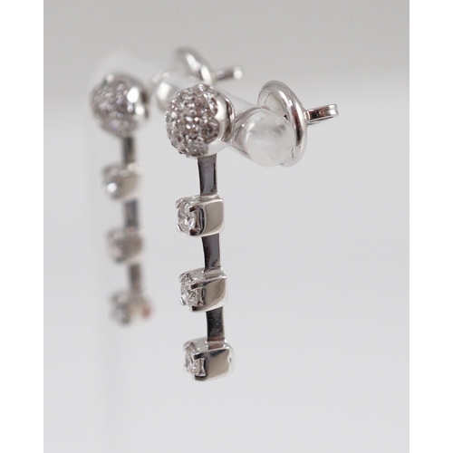 445 - A modern pair of 18ct white gold, diamond cluster and three stone diamond drop set earrings, 28mm, g... 