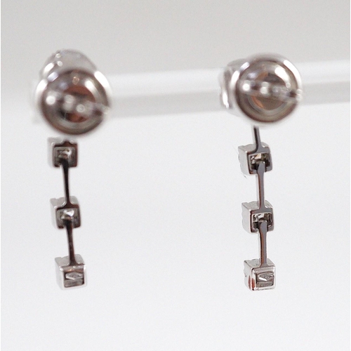 445 - A modern pair of 18ct white gold, diamond cluster and three stone diamond drop set earrings, 28mm, g... 