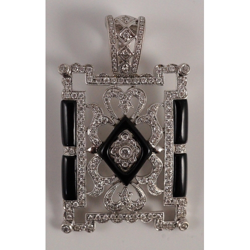 446 - A modern 1920's style pierced 18k white gold, diamond and black onyx set rectangular pendant, the to... 