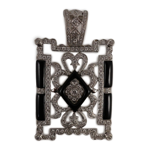 446 - A modern 1920's style pierced 18k white gold, diamond and black onyx set rectangular pendant, the to... 