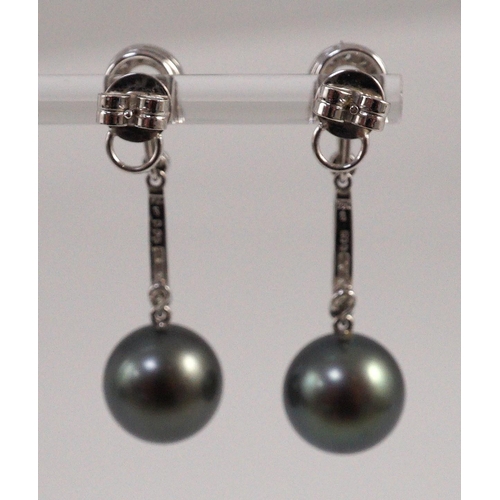 452 - A modern pair of single stone South Sea Tahitian pearl style and diamond chip set drop earrings, eac... 